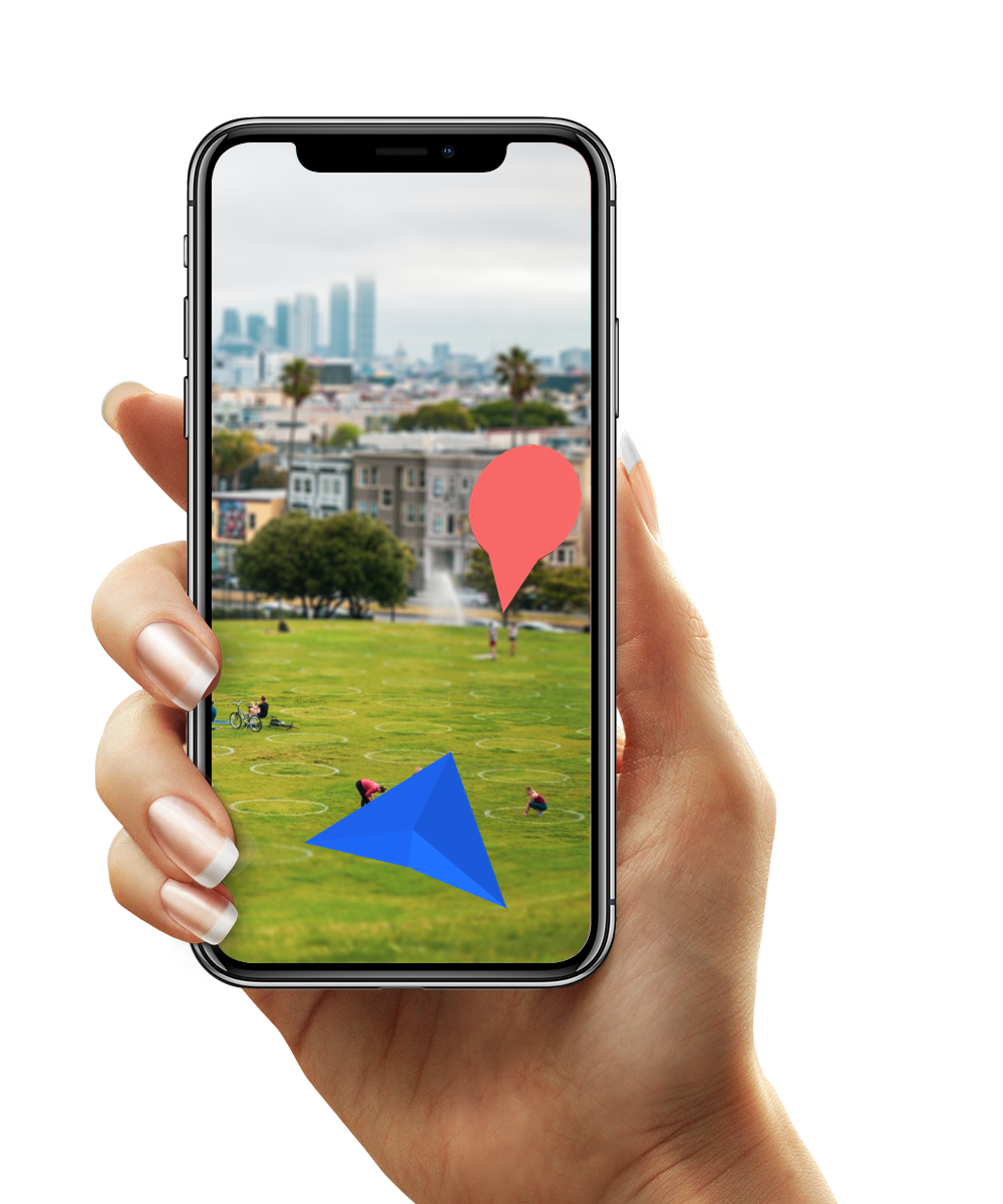 A phone showing an Augmented Reality direction to a place at a park.